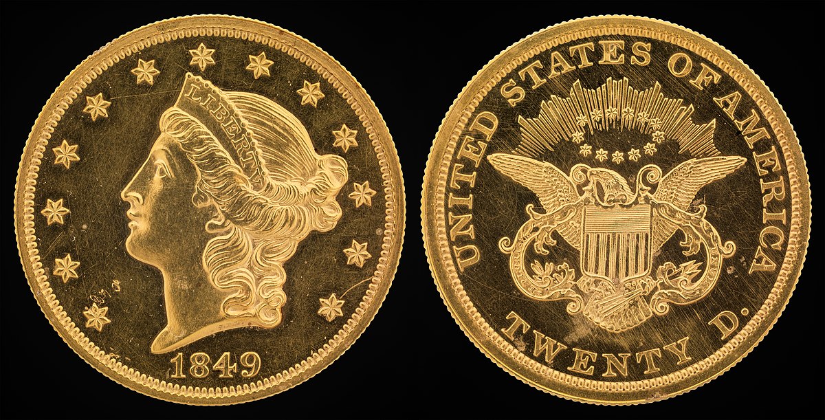 A gold coin with a plus and minus sign on each side.